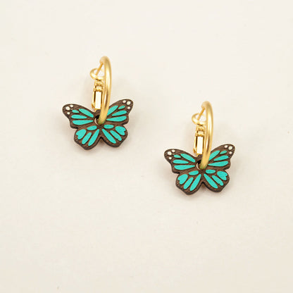 'Monarch Butterfly in Teal' hoop earrings featuring green butterflies by Materia Rica.